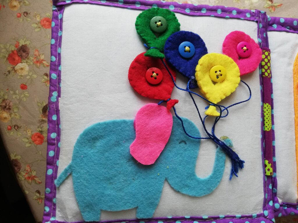 Elephant button with colors Quiet book page image